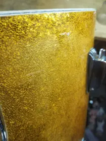Repairing scratches in '60s Sparkle wrap (Ludwig)