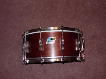 What is the definition of a real drum builder as opposed to a Drum assembler?