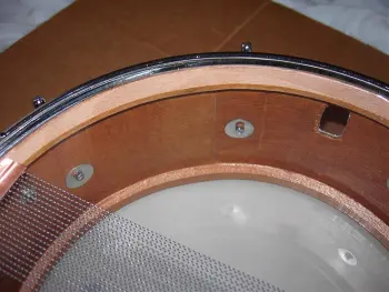 What is the definition of a real drum builder as opposed to a Drum assembler?