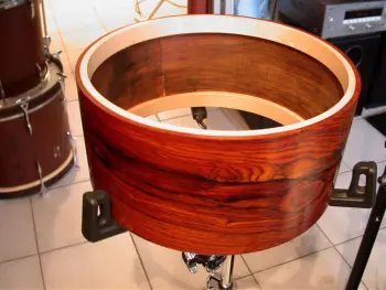What is the definition of a real drum builder as opposed to a Drum assembler?