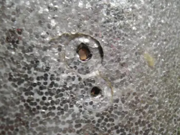 Repairing a dent in a drum