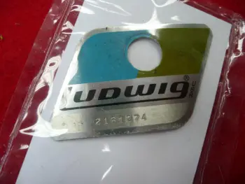 Blue/Olive badges with L before the serial?