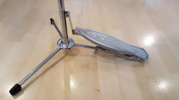 Vintage Hi-hats with foot board over one of the legs