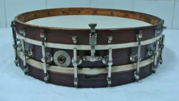 Cleaning up the shell of a 1908 Lyon Healy Single Head Snare