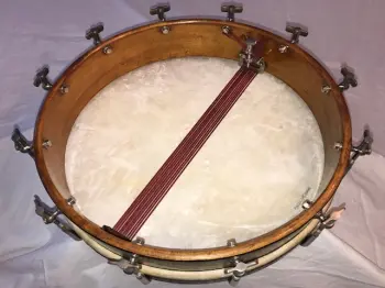 Cleaning up the shell of a 1908 Lyon Healy Single Head Snare