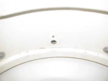 Ludwig Muffler screw under the knob or over the knob???