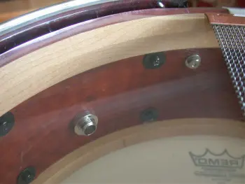 What is the definition of a real drum builder as opposed to a Drum assembler?