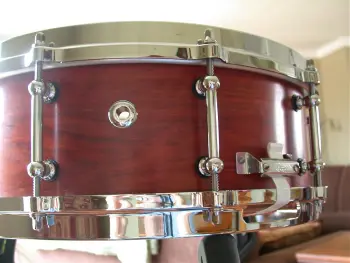 What is the definition of a real drum builder as opposed to a Drum assembler?