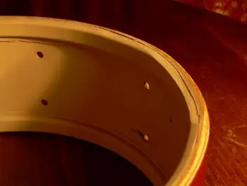Sling snare bearing edge recesses?